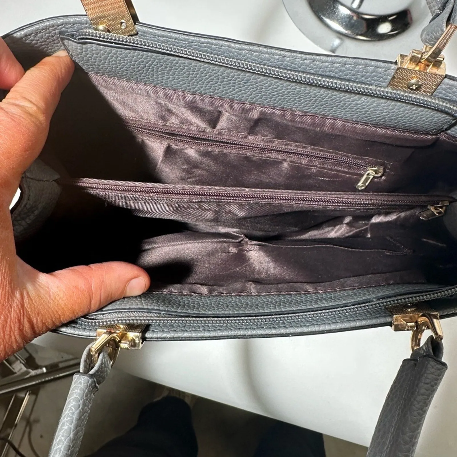 Gray Satchel with Structured Design and Gold Accents